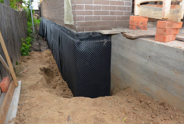 Happy homeowners after waterproofing job in Hesston